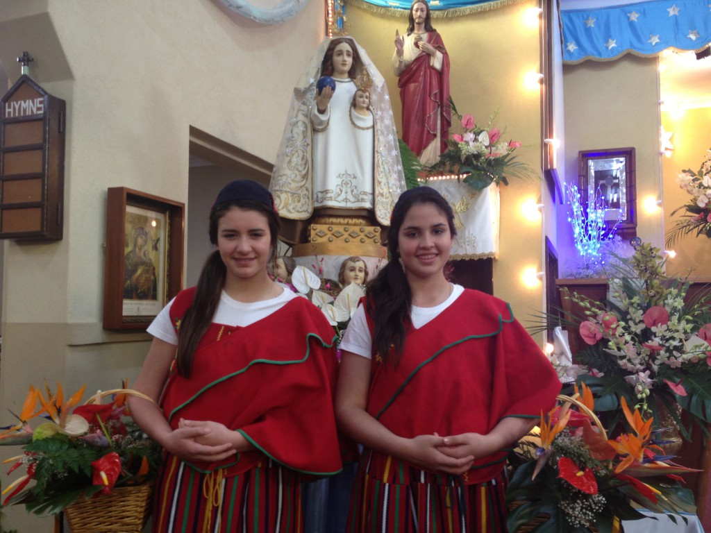 Jessica Romano and Eloise De Aguiar participate in the Feast of Our Lady of the Mount in traditional dress from Portugal ‘s Madeira Island. PHOTO: Mat De Sousa