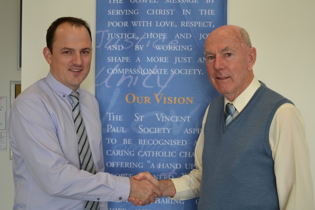 St Vincent de Paul Society’s WA CEO Mark Fitzpatrick, left, shakes hands with newly-appointed President Jeff Trew. PHOTO: Sarah Motherwell