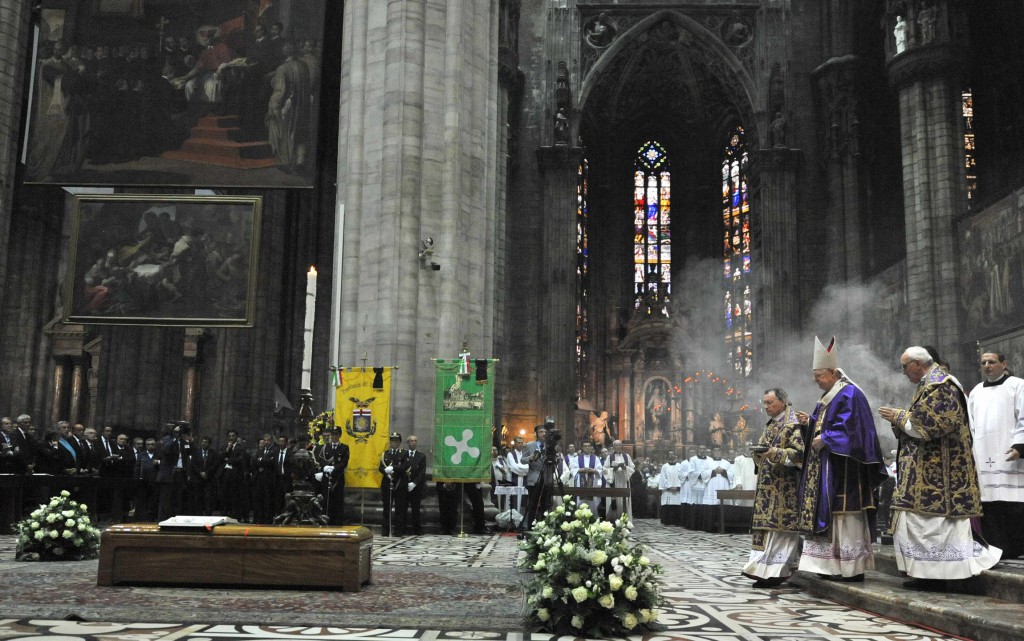 Cardinal Angelo Scola of Milan blesses the casket of Cardinal Carlo Maria Martini during his funeral Mass at the cathedral in Milan on September 3.