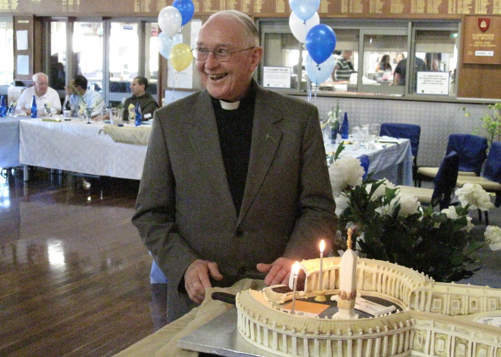Fr Brian Morgan enjoys the moment and the remarkable ‘Vatican’ cake at his 80th birthday party.