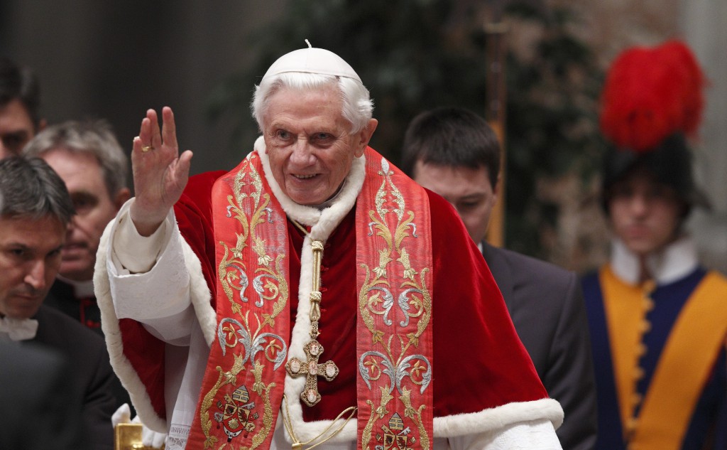 Pope Benedict XVI waves as he arrives to make remarks at the conclusion of the opening Mass of the International Congress on the Church in America held in St Peter’s Basilica at the Vatican on December 9.