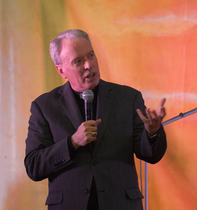 Auxiliary Bishop Donald Sproxton talking at a youth event post World Youth Day held in Perth WA