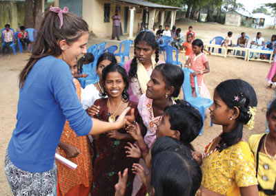 Year 11 Servite Student, Georgia Seragusana, is greeted by children at a Servite parish picnic in Chennai.