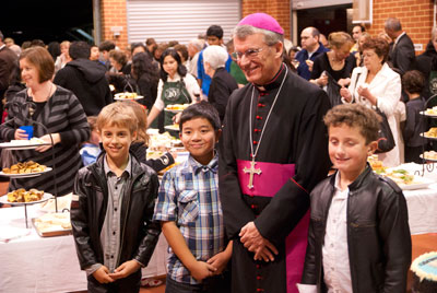 Archbishop Timothy Costelloe with students from St Columba’s Catholic Primary School after the dedication of their church. 