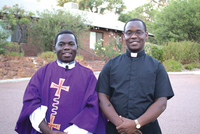 Lesmurdie Parish Priest Fr Kenneth Asaba welcomes his nephew and new assistant priest, Fr Cyprian Shikokoti.