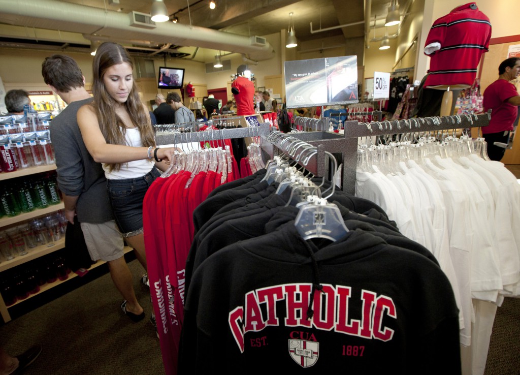 Jill Pryor of Northport, N.Y., looks over T-shirts at The Catholic University of America bookstore in Washington. PHOTO: CNS/Nancy Phelan Wiechec