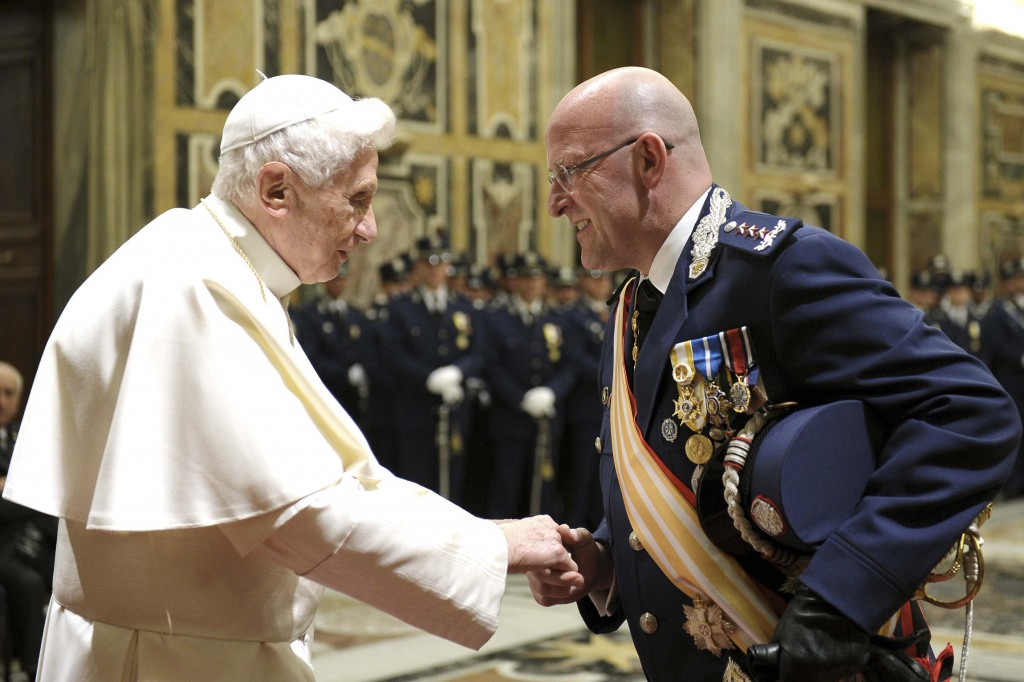 Pope Benedict XVI greets Domenico Giani, the Vatican police chief, during a private audience at the Vatican on January 11. PHOTO: CNS/L’Osservatore Romano