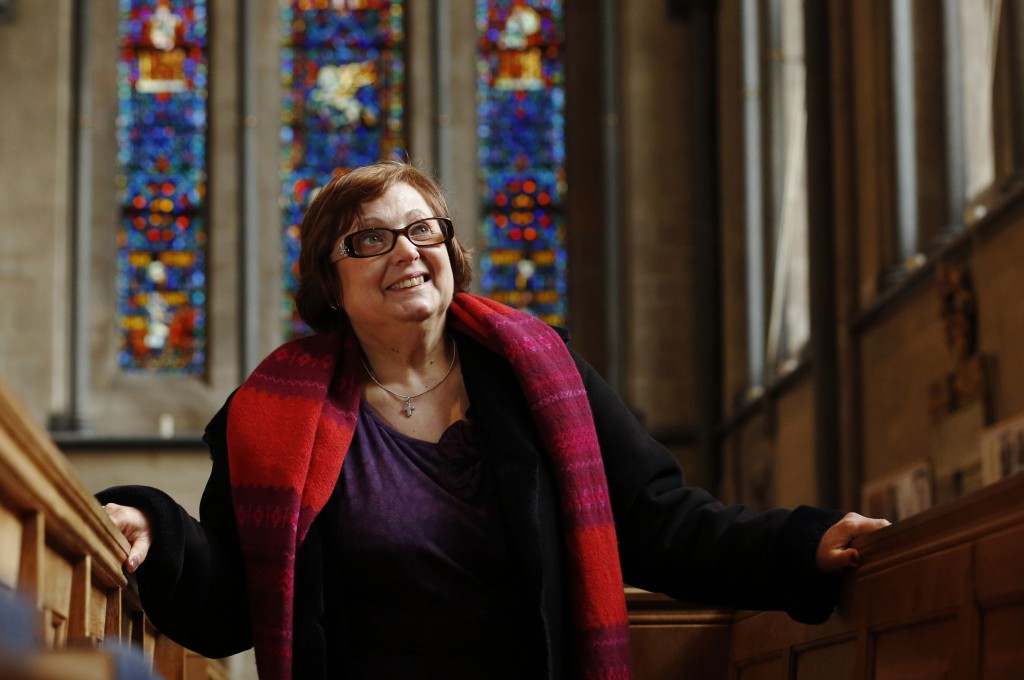 Nadia Eweida, 60, a Christian, poses for a photograph in a church in London on January 15. Eweida, an employee who was asked by British Airways to remove a cross from around her neck, has won a religious discrimination case at Europe’s human rights court, but three other claimants lost similar cases. PHOTO: Luke Mcgregaor, Reuters