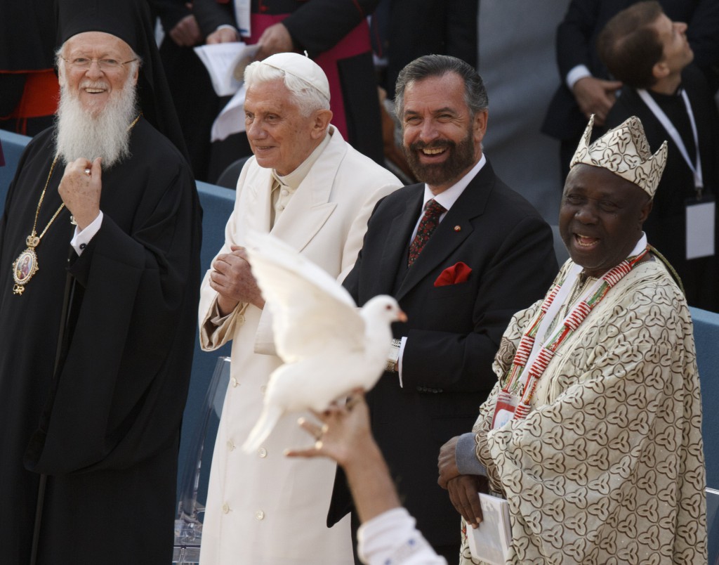 Ecumenical Patriarch Bartholomew of Constantinople, Pope Benedict XVI, Rabbi David Rosen and Wande Abimbola, representative for the Yoruba religion of Nigeria, smile as a dove is held up during the interfaith meeting for peace outside the Basilica of St. Francis in Assisi, ItalyEcumenical Patriarch Bartholomew of Constantinople, Pope Benedict XVI, Rabbi David Rosen and Wande Abimbola, representative for the Yoruba religion of Nigeria, smile as a dove is held up during the interfaith meeting for peace on Oct. 27 2012 outside the Basilica of St. Francis in Assisi, Italy. PHOTO: CNS/Paul Haring