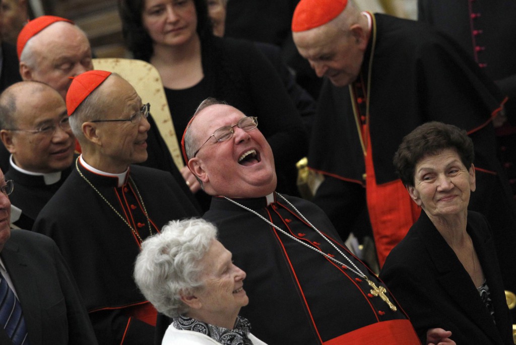 Cardinal Timothy M. Dolan of New york laughs as he waits for Pope Benedict XVI to begin a 2012 special audience in Paul VI hall at the Vatican. PHOTO: CNS/Alessandro Bianchi, Reuters