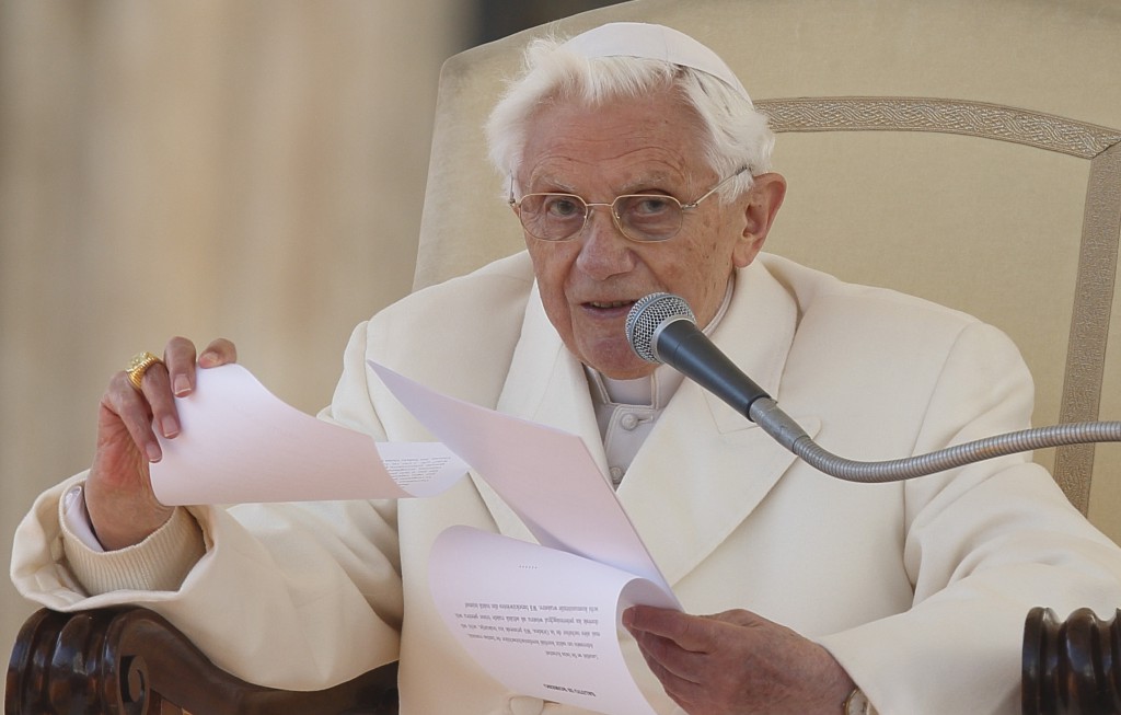 Pope Benedict XVI reads his address as he leads his final general audience on Feb. 27 in St. Peter's Square at the Vatican. PHOTO: CNS/Paul Haring)