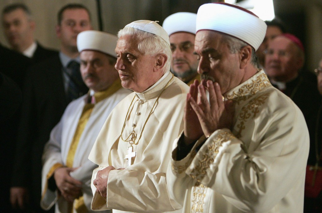 Pope Benedict XVI and Mustafa Cagrici, the grand mufti of Istanbul, pray in the Blue Mosque in 2006 in Istanbul. PHOTO: CNS/Patrick Hertzog, Pool via Reuters