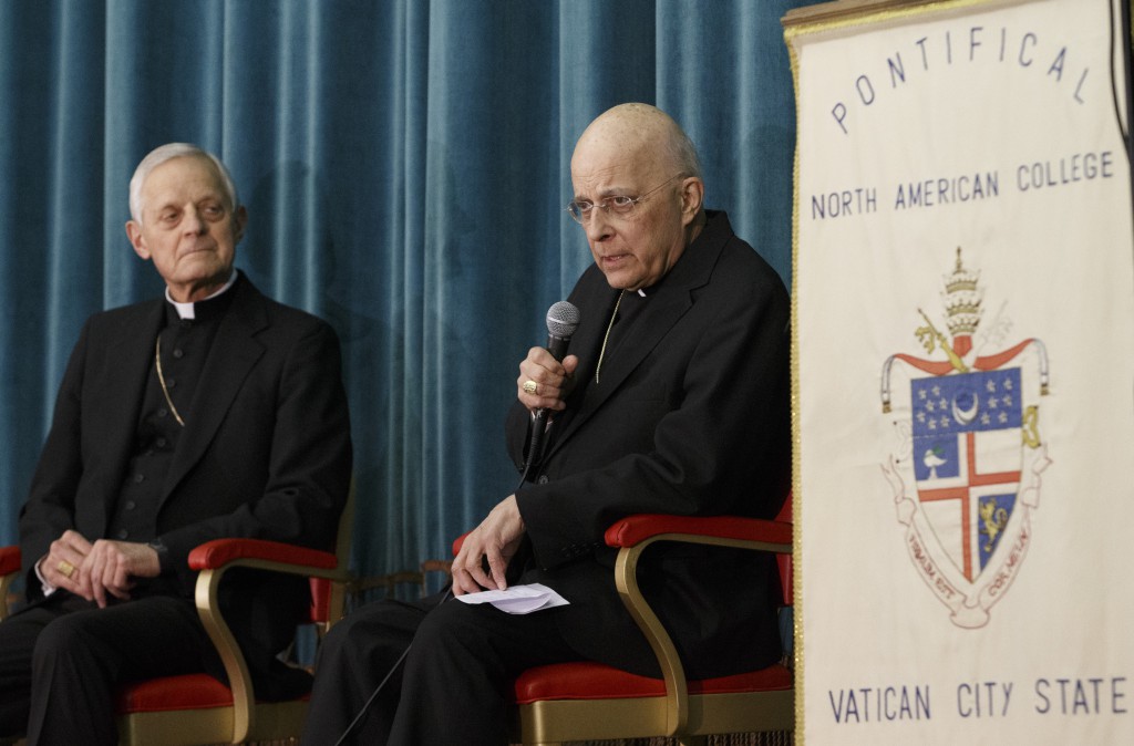 Cardinal Francis E. George of Chicago speaks as Cardinal Donald W. Wuerl of Washington looks on during a press conference at the Pontifical North American College in Rome March 4. The U.S. cardinals spoke after attending the first general congregation meeting of the world's cardinals at the Vatican. PHOTO: CNS/Paul Haring 