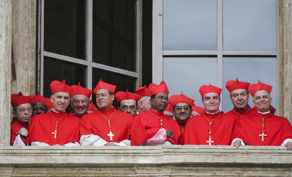 Cardinals gather on a side balcony of St. Peter's Basilica as they await the public introduction of the new pope in April 19, 2005. German Cardinal Joseph Ratzinger was elected the 265th pope and chose the name Benedict XVI. PHOTO: CNS/Nancy Wiechec