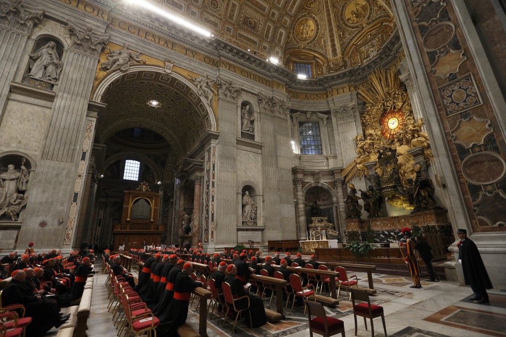 Cardinals attend a prayer service with eucharistic adoration in St. Peter's Basilica at the Vatican on March 6 where more than 100 cardinals gathered in front of Bernini's statue, "The Chair of St. Peter," for the evening service. PHOTO: CNS/Paul Haring