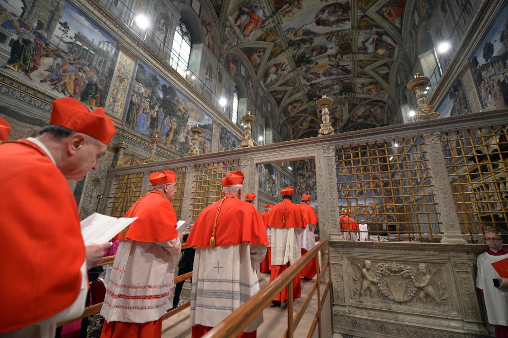 Cardinals from around the world enter the Vatican's Sistine Chapel on March 12 as they begin the conclave to elect a successor to Pope Benedict XVI. PHOTO: CNS/L'Osservatore Romano via Reuters