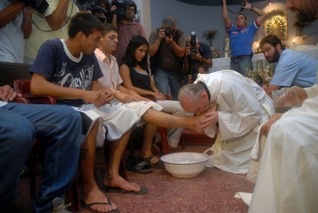 Pope Francis, then Argentine Cardinal Jorge Mario Bergoglio, washes and kisses the feet of residents of a shelter for drug users during Holy Thursday Mass in 2008 at a church in a poor neighborhood of Buenos Aires, Argentina. PHOTO: CNS/Enrique Garcia Medina, Reuters 