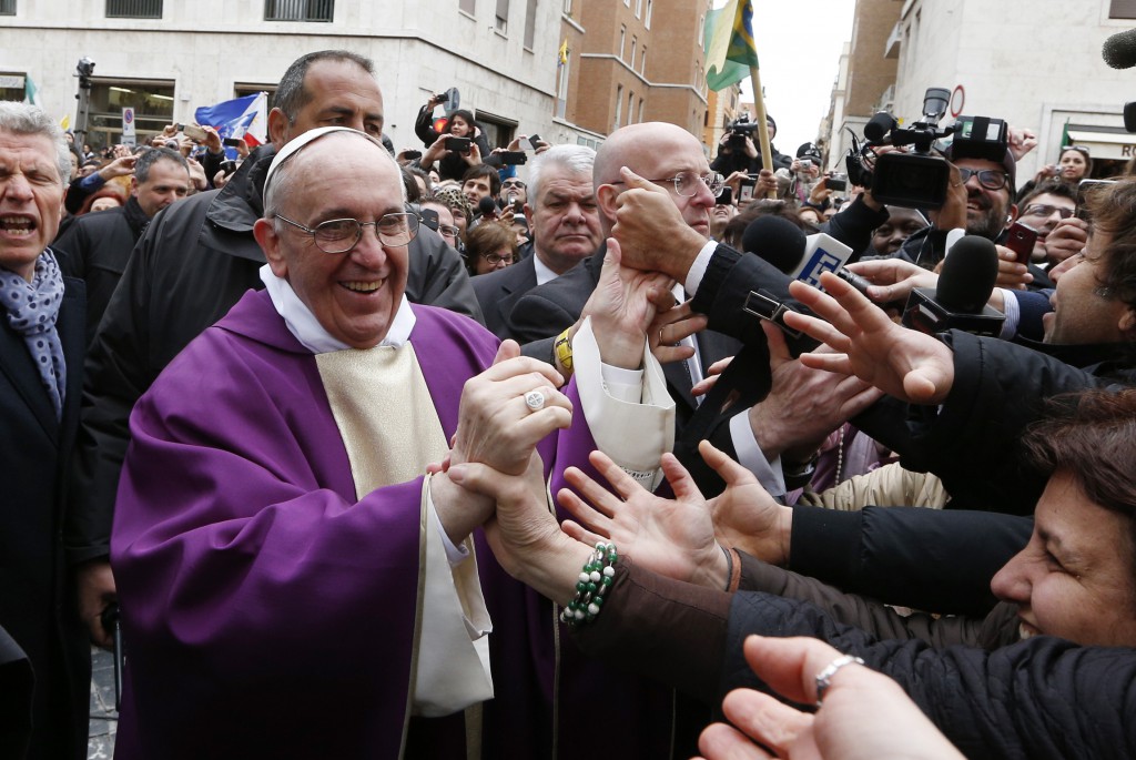 Pope Francis greets people after celebrating Mass on March 17 at St. Anne's Parish within the Vatican. PHOTO: CNS/Paul Haring