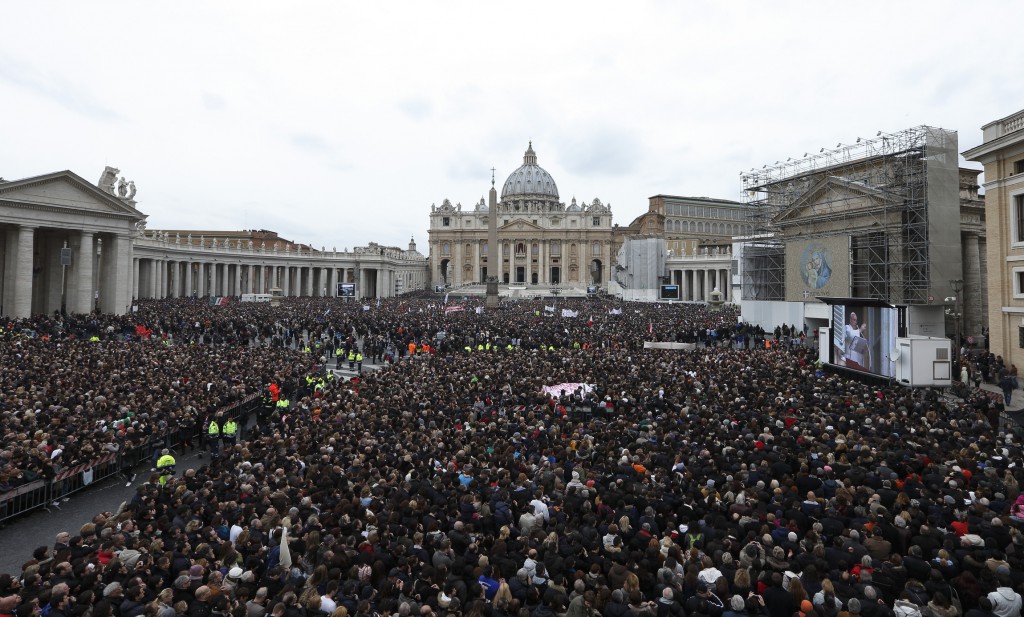 A huge crowd overflows St. Peter's Square as Pope Francis delivers his blessing during his first Angelus March 17 at the Vatican. PHOTO: CNS/Paul Haring