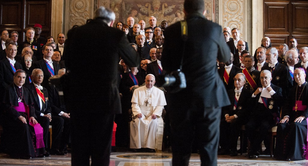 Pope Francis poses for photographs with the Vatican diplomatic corps during an audience in the Sala Regia of the Apostolic Palace. PHOTO: CNS/Alessia Giuliani, Catholic Press Photo