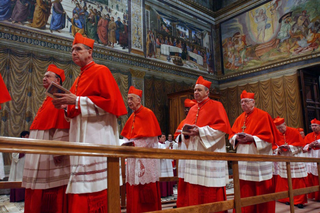 Cardinals enter the Sistine Chapel at the beginning of the conclave at the Vatican in April 18, 2005, PHOTO: CNS/L'Osservatore Romano via Catholic Press
