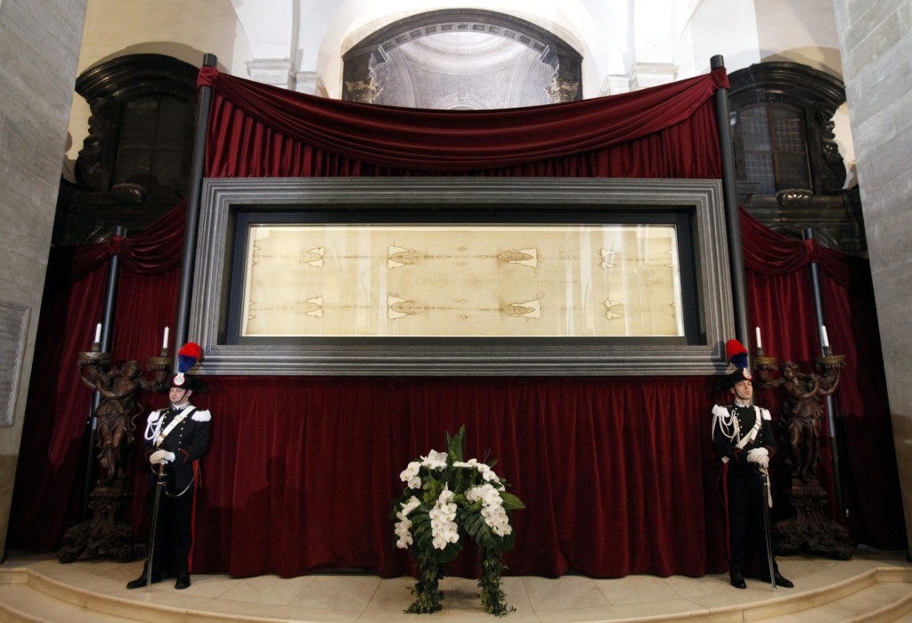 Carabinieri police officers stand guard in front of the shroud at the Cathedral of St. John the Baptist during the shroud exhibition on May 2, 2010 in Turin, Italy. PHOTO: CNS/Alessandro Garofalo, Reuters