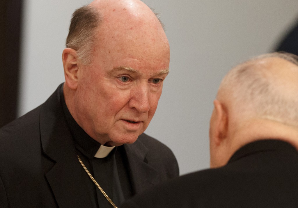 Bishop W. Francis Malooly of Wilmington, Del., talks with Cardinal Theodore E. McCarrick, retired archbishop of Washington, before the start of a Jan. 18 meeting at the Congregation for Catholic Education during U.S. bishops' "ad limina" visits to the Vatican.  PHOTO: CNS/Paul Haring