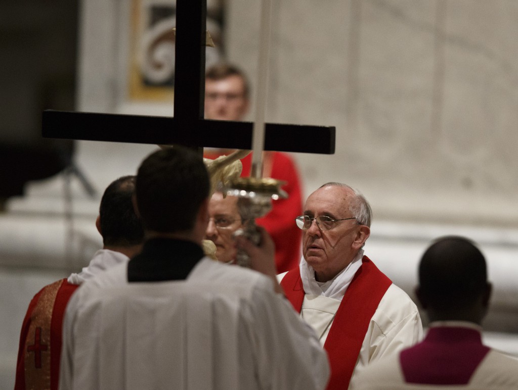 Pope Francis venerates the crucifix during the Liturgy of the Lord's Passion on Good Friday in St. Peter's Basilica on March 29 at the Vatican. PHOTO: CNS/Paul Haring