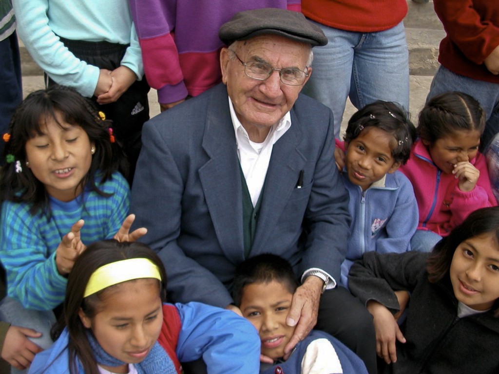 Father Joseph Walijewski, pictured in an undated photo, is surrounded by children at Casa Hogar Juan Pablo II, the orphanage he founded in Lurin, Peru. PHOTO: CNS/courtesy of Casa Hogar
