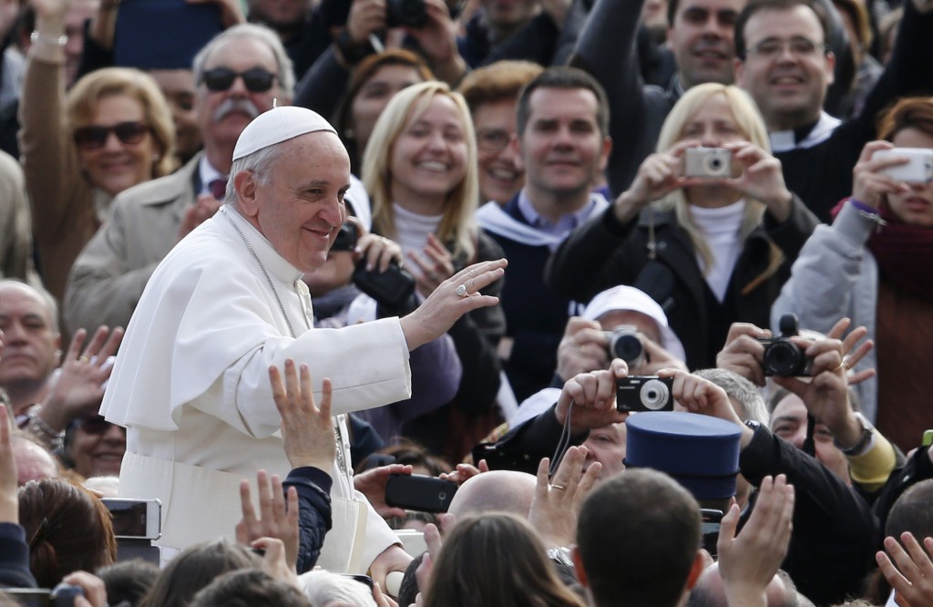 Pope Francis greets the crowd as he arrives to lead his general audience on April 3 in St. Peter's Square at the Vatican. PHOTO: CNS/Paul Haring