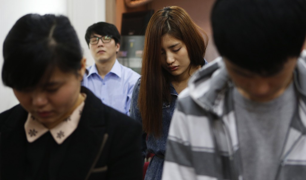 North Korean defectors living in Seoul pray for peace and reunification of the divided Korean Peninsula, during a church service on April 7 in Seoul. PHOTO: CNS/ Lee Jae-Won, Reuters