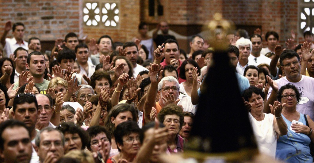 Worshippers pray in the Basilica of the National Shrine of Our Lady Aparecida in 2007 in Brazil. PHOTO: CNS/Paulo Whitaker, Reuters