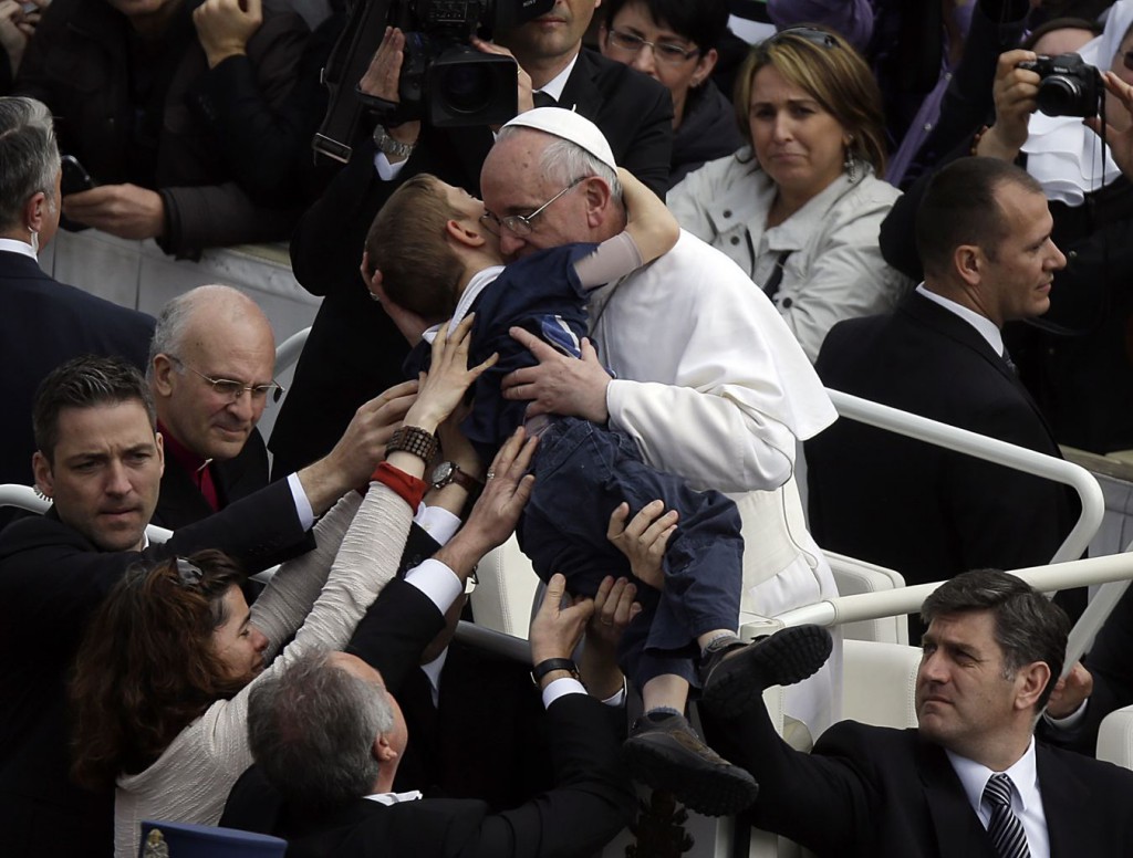 Pope Francis lifted Dominic, who has cerebral palsy, while embracing and kissing him. He also spoke to the boy before gently placing the child back into his mother's arms.