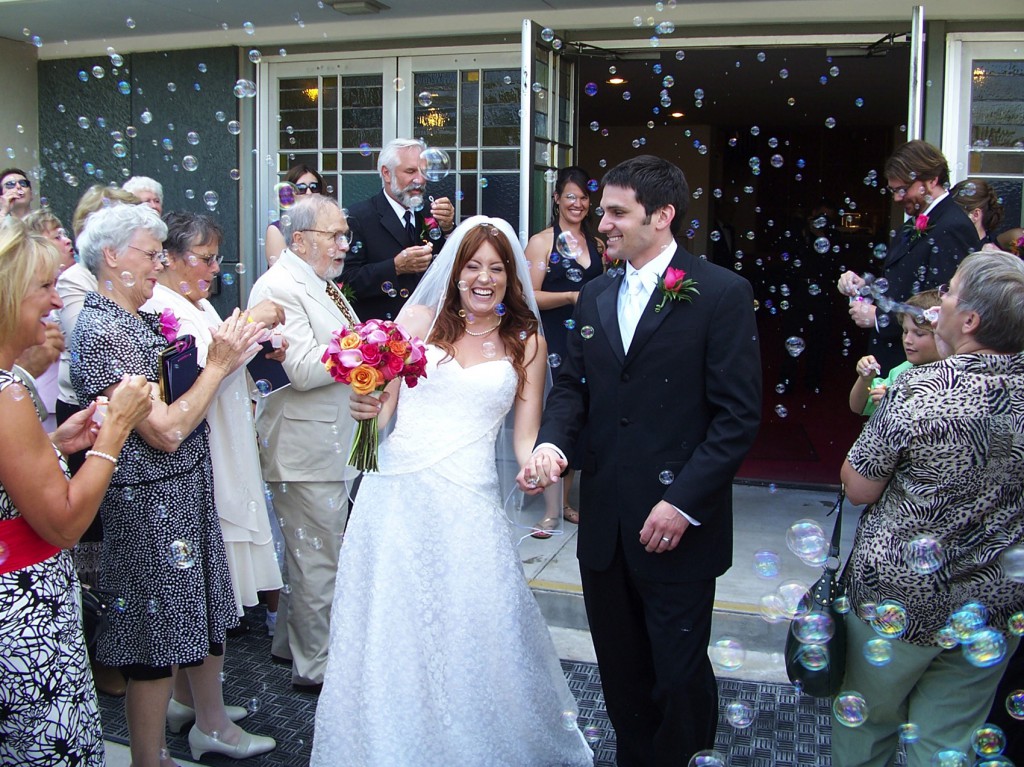 A shower of bubbles greets Jamie and Zac O'Brien as they leave St. Joseph's Church in Pekin, Ill., after their wedding Mass in 2007. PHOTO: CNS/Tom Dermody, The Catholic Post  
