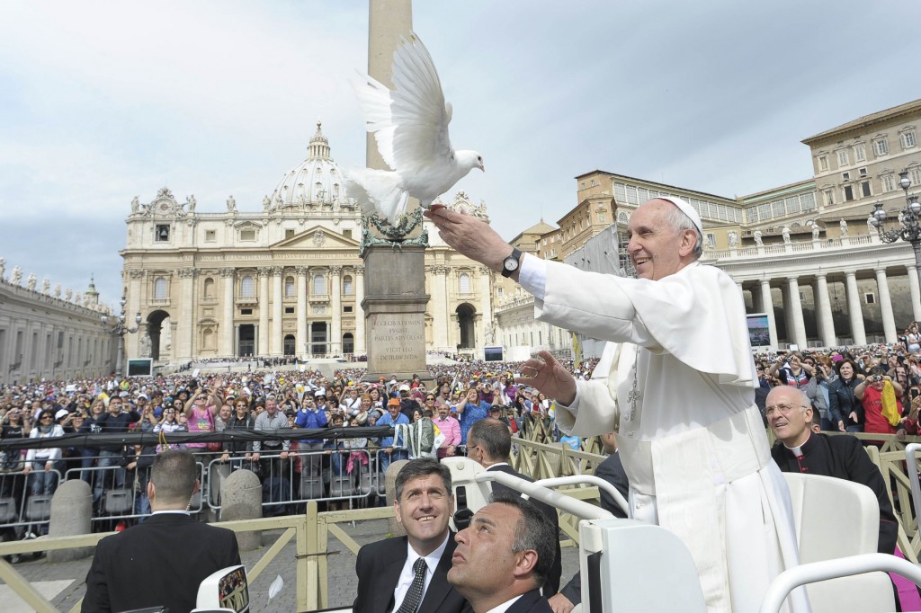 Pope Francis holds a dove before his weekly audience in St. Peter's Square at the Vatican May 15. PHOTO: CNS/L'Osservatore Romano via Reuters