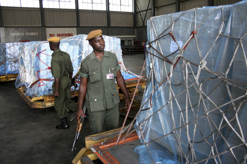 Police at the international airport in Lusaka, Zambia, Oct. 12 2012 check a shipment of ballot papers used in the presidential by-election. PHOTO: CNS/ Mackson Wasamunu, Reuters