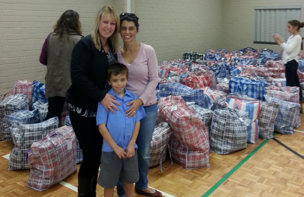 Little champion of charity, Vincent Pettinicchio, and his mother, Pina, with goods Vincent asked people to donate for Perth’s homeless. PHOTO: JOAN D’VORAK