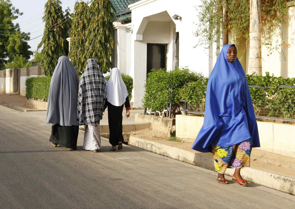 Women walk in a street in a residential area in Borno State, Nigeria, May 19. Sister Kathleen McGarvey, a member of the Sisters of Our Lady of Apostles in Ireland, says she sees women having an important role in fostering peace in northern Nigeria's conflict zones. PHOTO: CNS/Afolabi Sotunde, Reuters