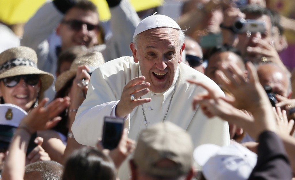 Pope Francis greets pilgrims as he arrives for his weekly general audience in St. Peter's Square on June 12 at the Vatican. 