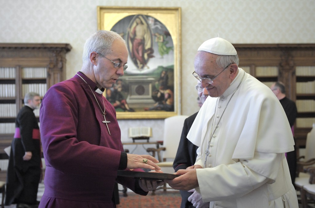 Pope Francis exchanges gifts with the Anglican Archbishop Justin Welby of Canterbury, England, on June 14 during a private audience at the Vatican. PHOTO: CNS/Stefano Spaziani, pool