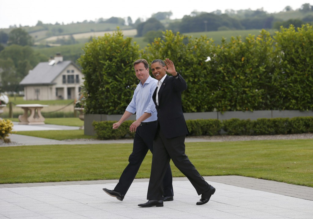 Britain's Prime Minister David Cameron walks with U.S. President Barack Obama at the Lough Erne golf resort, where the Group of Eight leaders are meeting on June 17 in Enniskillen, Northern Ireland. PHOTO: CNS/Suzanne Plunkett, Reuters