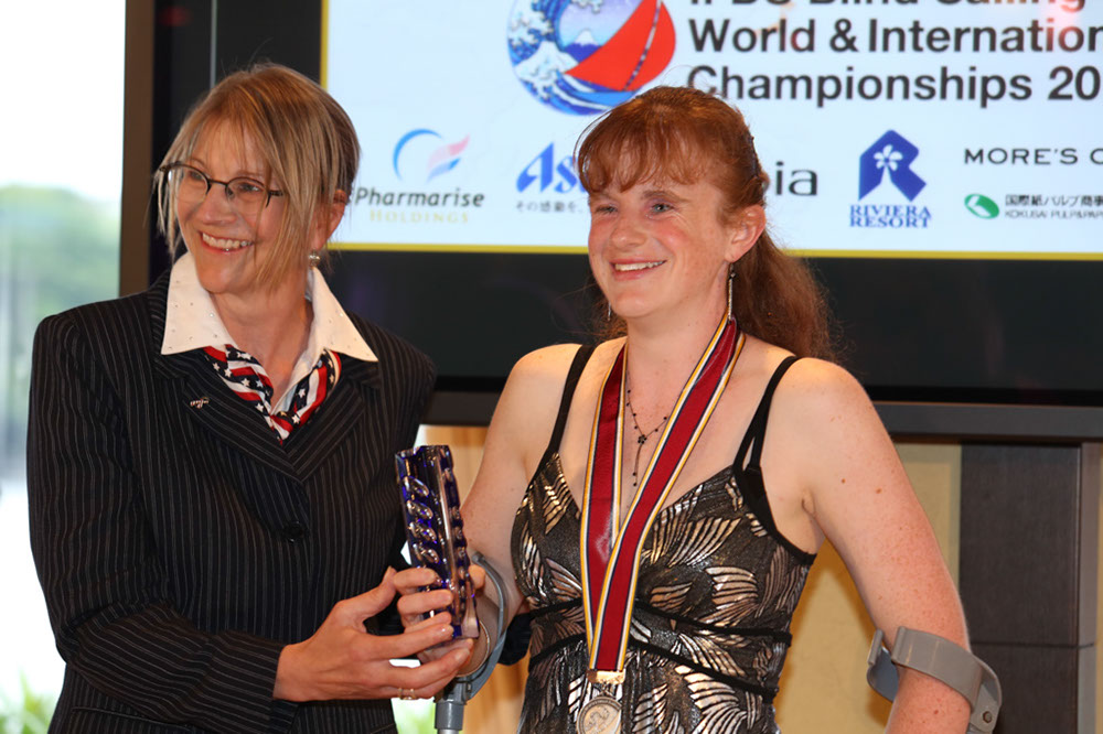 Claremont parishioner Kylie Forth receives an award for the best sailor at the Blind Sailing World Championships recently held in Japan.