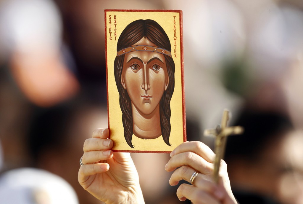 A pilgrim holds up an icon of St. Kateri Tekakwitha before a Mass of canonization for seven new saints on Oct. 2, 2012 in St. Peter's Square at the Vatican. PHOTO: CNS/Stefano Rellandini, Reuters