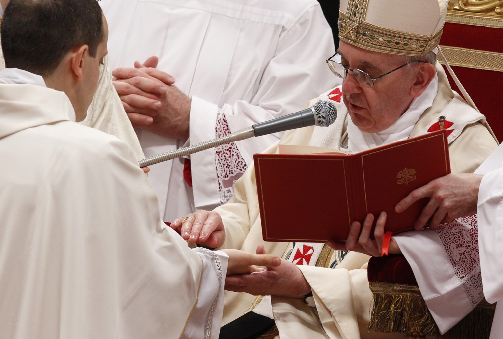 Pope Francis anoints one of the 10 priests he ordained on April 21, 2013 in St. Peter's Basilica at the Vatican. PHOTO: CNS photo/Paul Haring