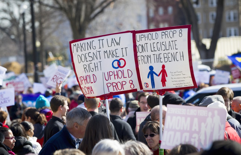 People demonstrate outside the Supreme Court building in Washington in this photo from late March, when the court heard oral arguments in two same-sex marriage cases. PHOTO: CNS/Nancy Phelan Wiechec