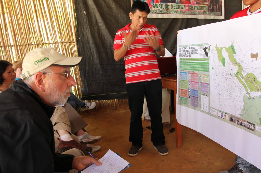 Bishop Gerald F. Kicanas of Tucson, Ariz., chairman of the board of Catholic Relief Services, listens to Kechwa leader Walter Sangama explain communities' land-rights conflicts on June 27 in Lamas, Peru. PHOTO: CNS/Barbara Fraser