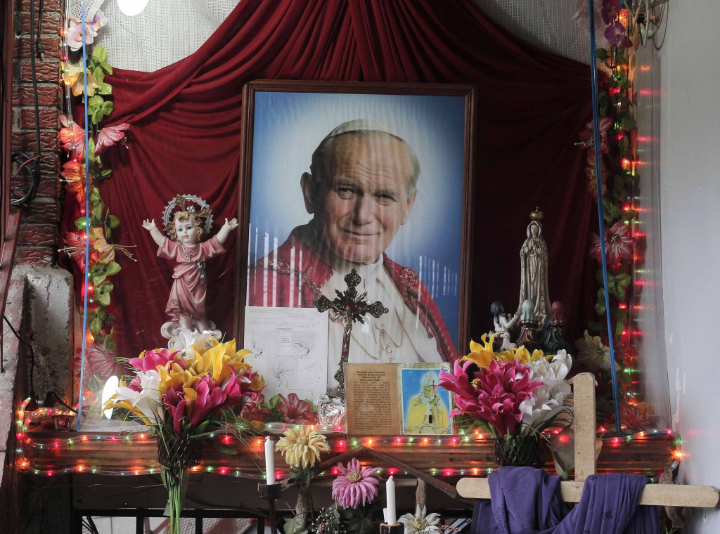 An altar containing images of Blessed John Paul II is pictured in the house of Floribeth Mora Diaz, the Costa Rican woman whose inexplicable cure has been attributed to the intercession of the late Polish pontiff, July 4 in Cartago, Costa Rice. The Vatican announced July 5 that Pope Francis has signed the decree approving his sainthood. PHOTO: CNS/Juan Carlos Ulate