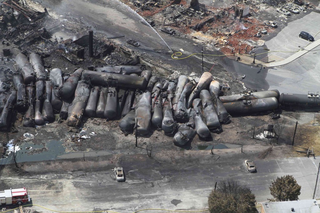 Burned train cars are seen in this July 8 aerial view following a derailment and explosion in Lac-Megantic, Quebec. PHOTO: CNS/Transportation Safety Board of Canada via Reuters