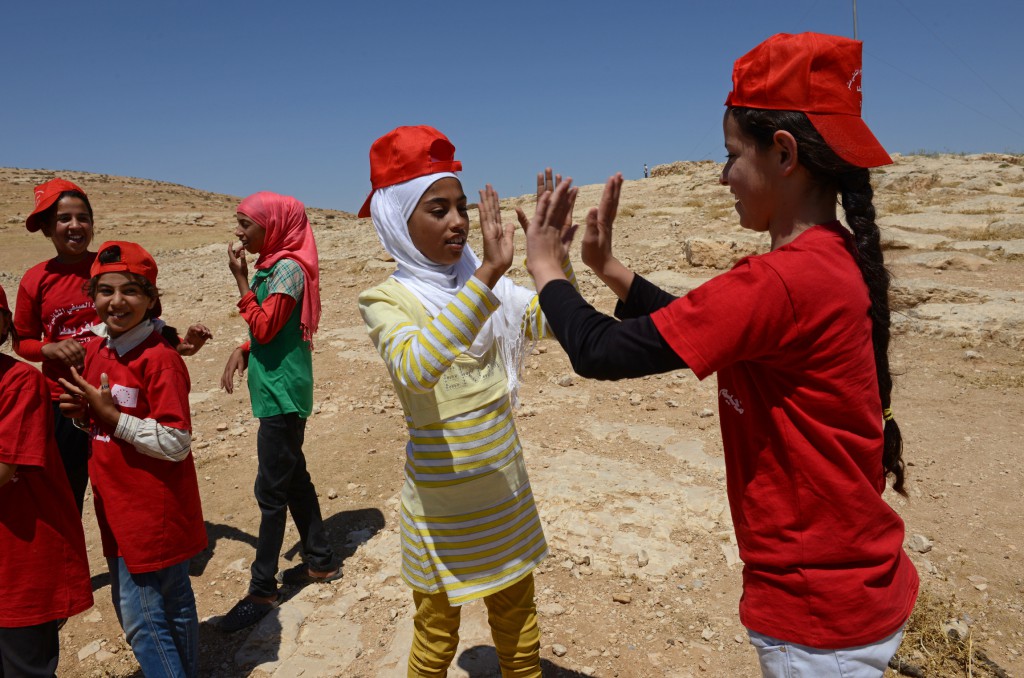 Girls from the South Hebron Hills play a game at a summer camp in the West Bank village of Tuba June 28. The camp is a welcome break for Palestinian children caught in the upheaval of Palestinian-Israeli frictions. PHOTO: CNS/Debbie Hil