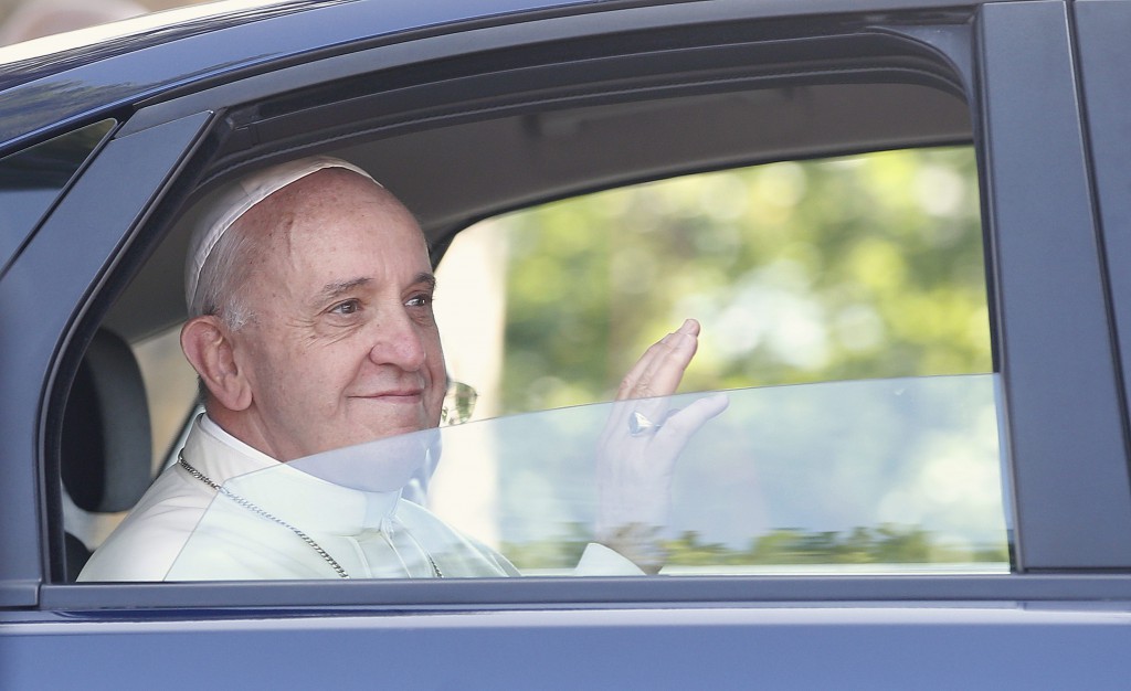 Pope Francis waves from a car during his visit to Castel Gandolfo, Italy, July 14. He is set to make his first international trip as pope, arriving in Rio de Janeiro July 22 for the celebration of World Youth Day. PHOTO:CNS/Tony Gentile, Reuters